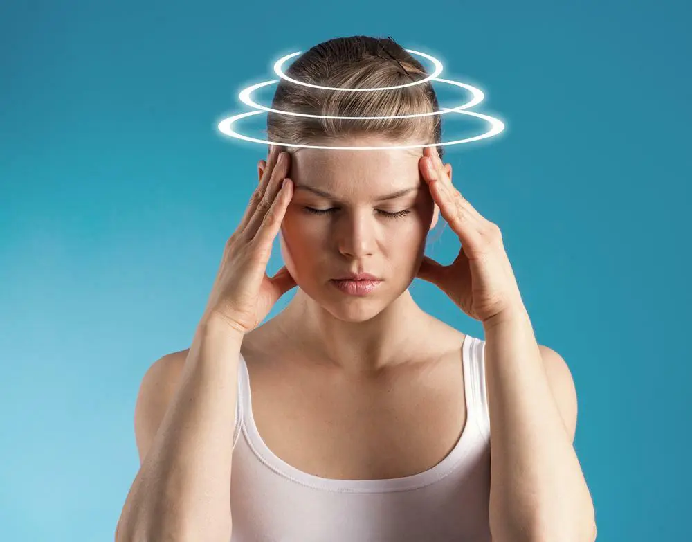 Woman suffering from headache in Omaha