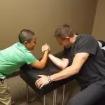 Dr. kosak arm wrestling a young boy