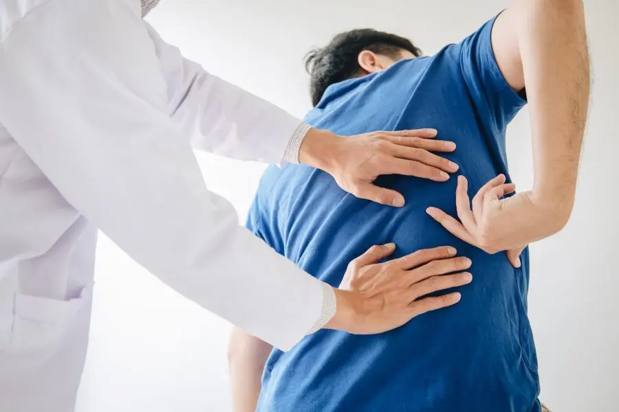 patient with a pinched nerve in his back 