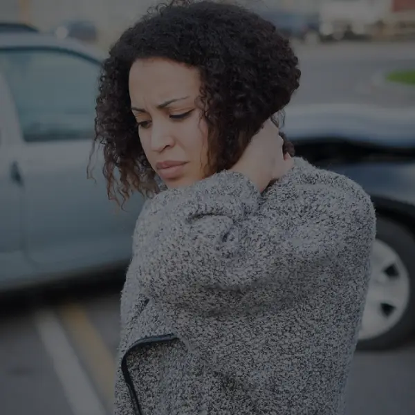 woman experiencing whiplash from a recent car crash