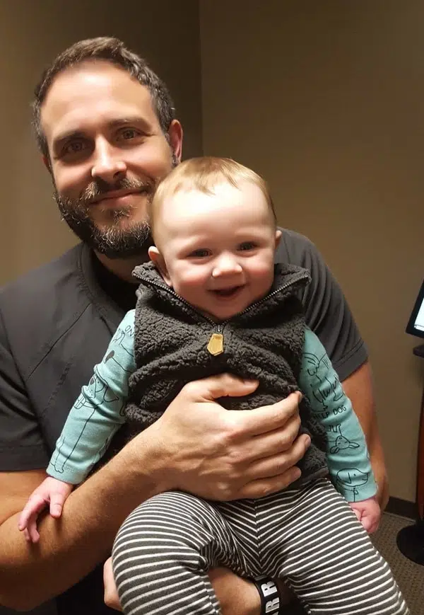 Dr. Kosak with a baby
