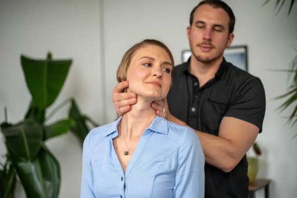 Chiropractor is doing some chiropractic adjustment to the patient.