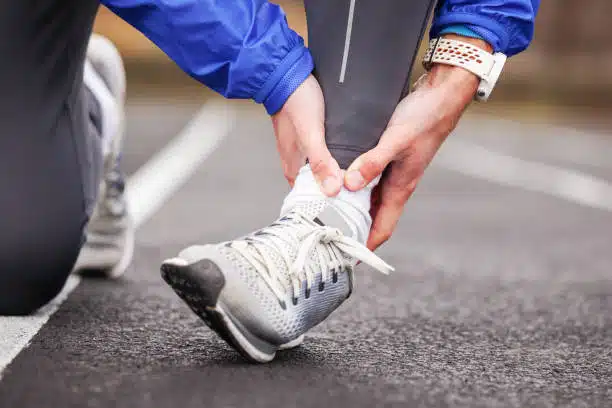 cropped shot of a man's twisted foot during accident while walking in the road.