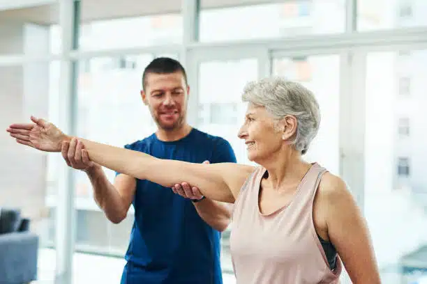 Chiropractic helping a patient to do some stretching.