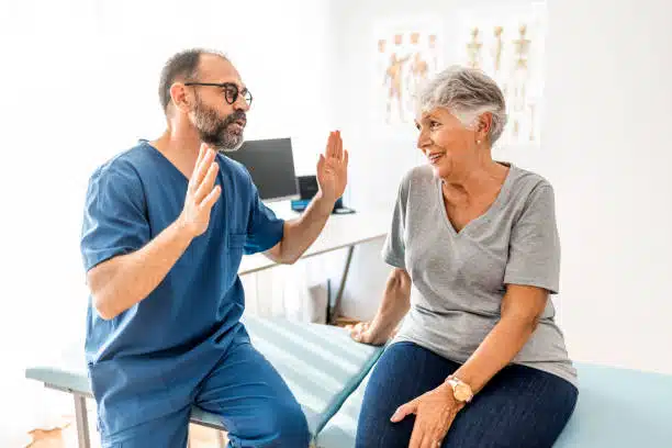 Chiropractor explaining the health insurance benefits to the patient.