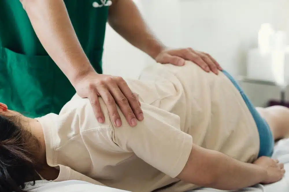 Chiropractor doing some chiropractic adjustment to the patient.