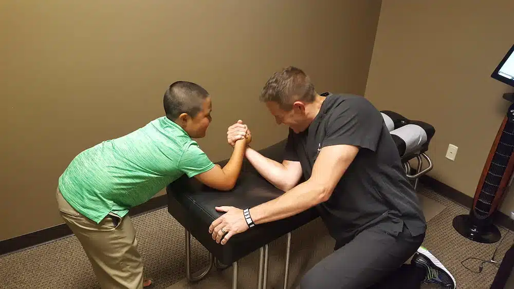 Dr. Kevin Kosak and kid patient for pediatric chiropractor 